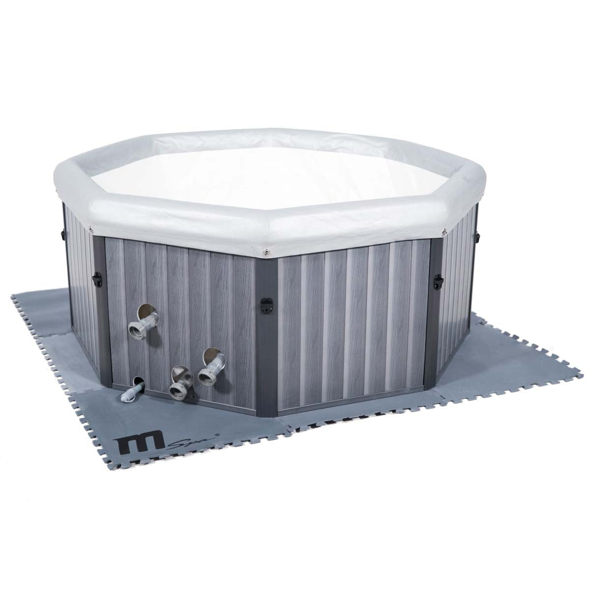 Grau-schwarze wärmeisolierte Schaumstoff-Bodenmatte mit gezackten Kanten unter rundem grauem MSpa Whirlpool.