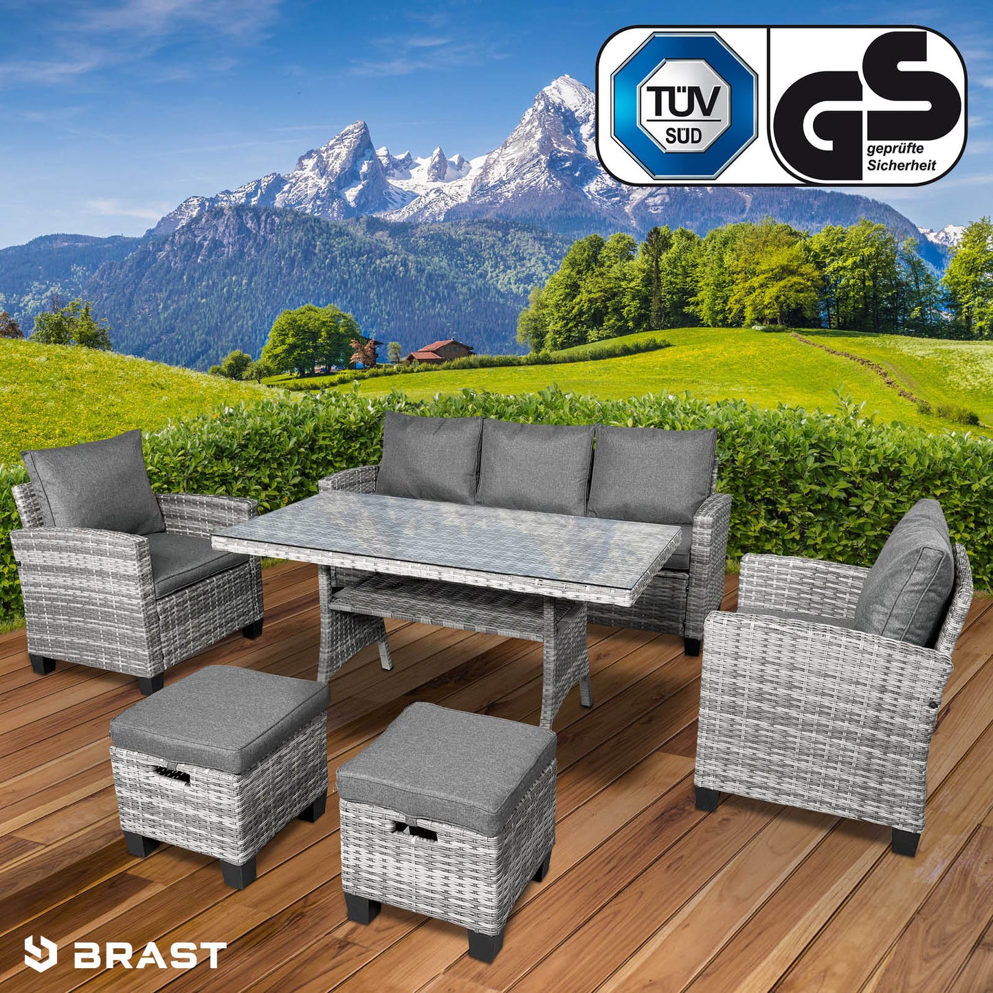 Graue Polyrattan Gartengarnitur mit Ecksofa, zwei Sesseln, Tisch und Hockern als Gartenmöbel Sitzgruppe.
