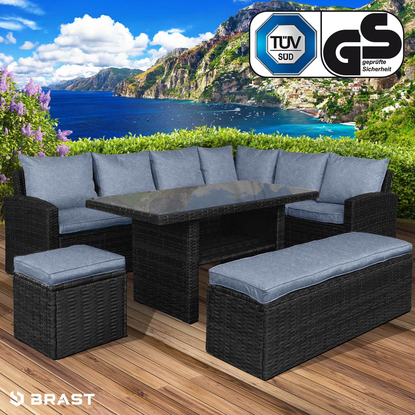 Schwarze Poly-Rattan Sitzgruppe Garten mit blauen Polstern, rechteckiger Tisch, Hocker und Ecksofa als Gartengarnitur.